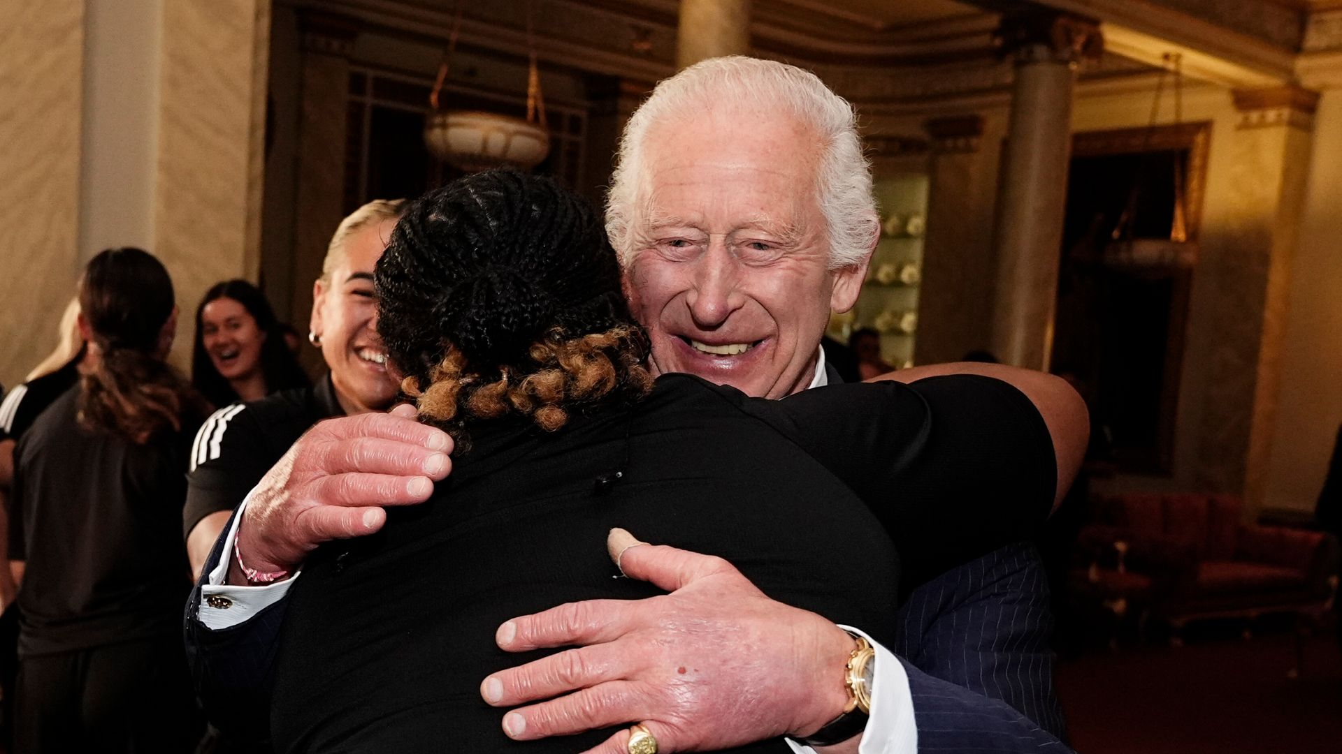 ‘Why not’: King giggles as he finds himself in group hug with New Zealand rugby team