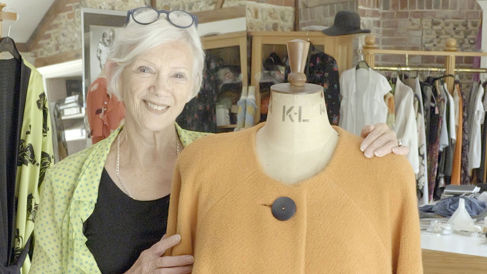 Fashion designer reunited with long-lost garment after charity shop find