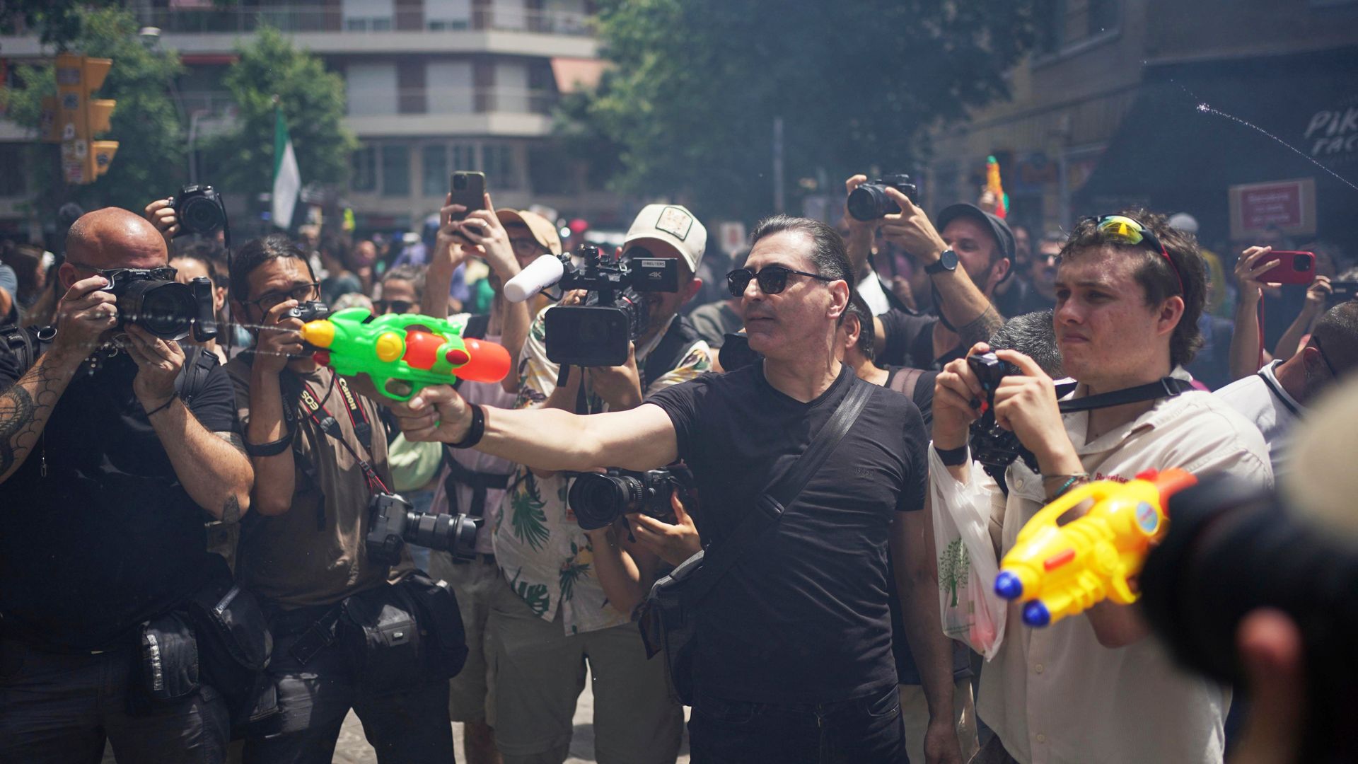 Anti-tourism protesters – some armed with water pistols – call for change in European hotspots